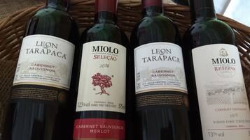 Four bottles of wine, each with a label indicating they are Cabernet Sauvignon from Leon de Tarapaca.