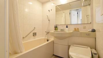 Combined shower/tub, free toiletries, hair dryer, slippers