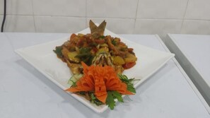 Freshly prepared dishes are served on this elegant table setting.