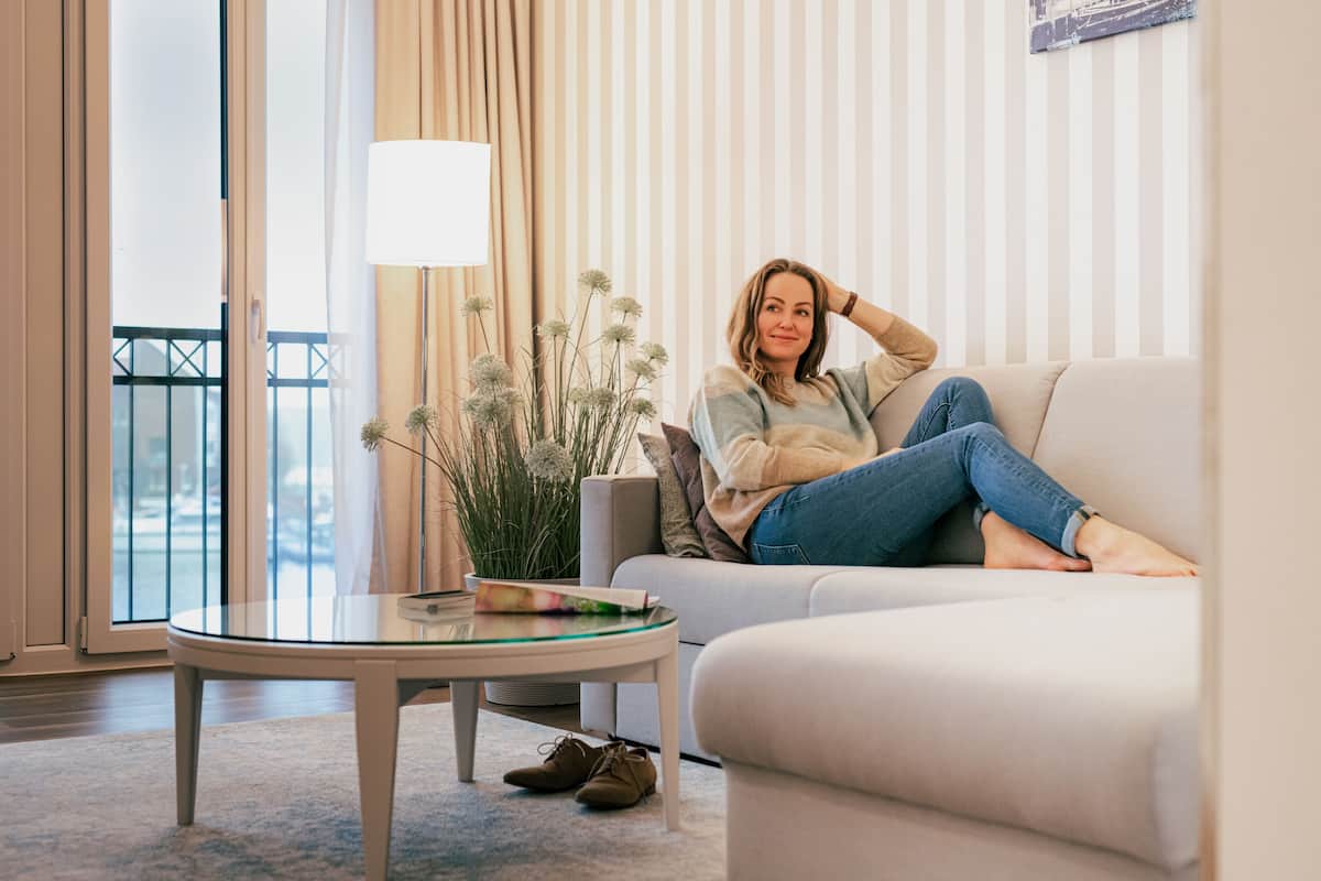 deluxe double room, balcony, harbour view | living area | flat-screen tv