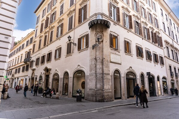 A historic building with multiple storefronts, including 'Aesop' and 'Mango'. - DC Collection Spagna (Rome)