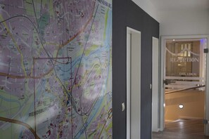 Explore the local area with our detailed city map, leading to a convenient reception and dining area.