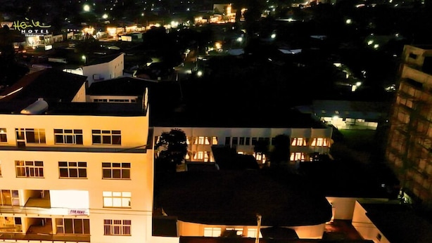 A hotel with multiple floors, balconies, and a well-lit exterior. - Haile Hotel Shashemene (Shashamane)