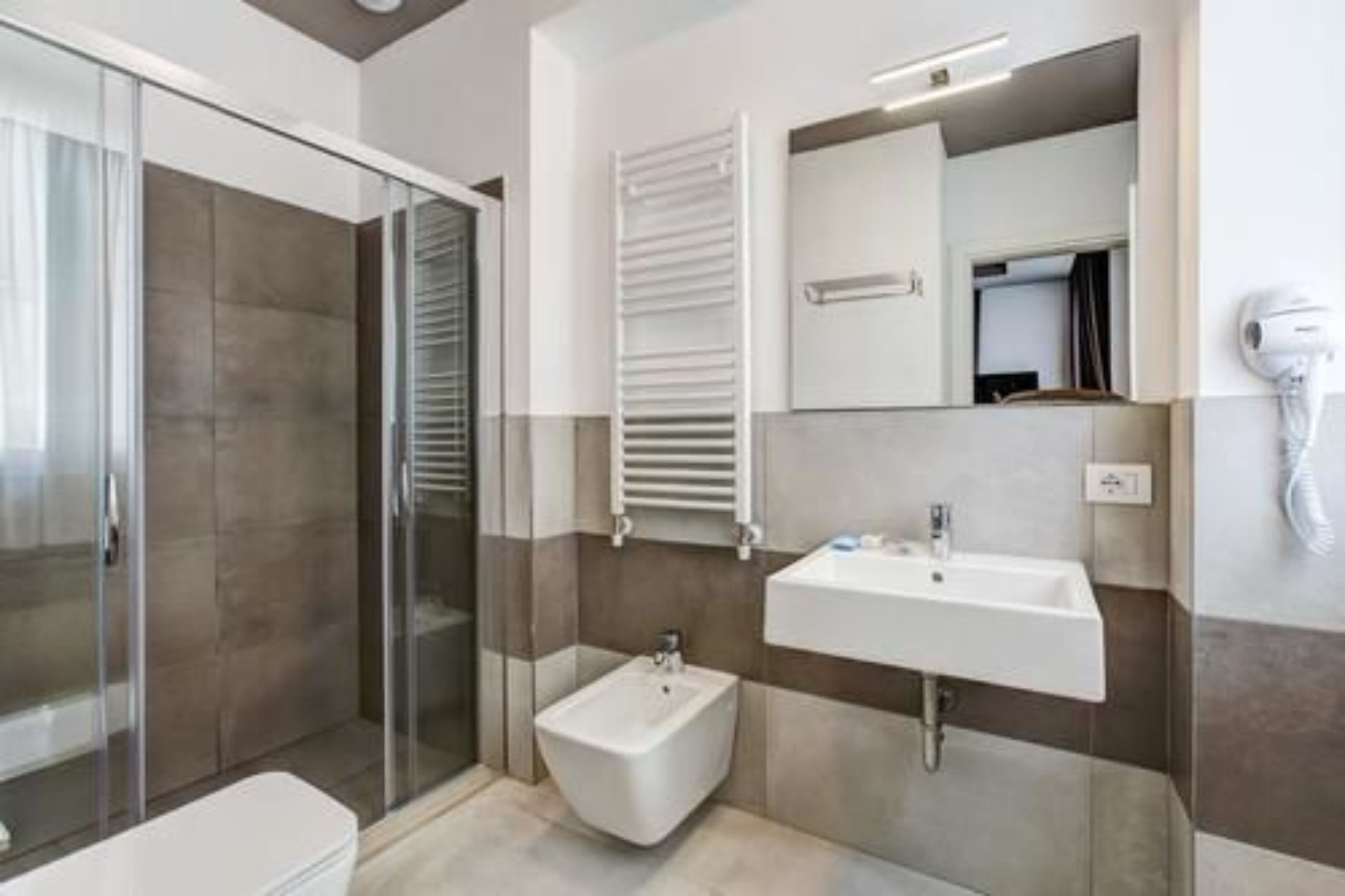 shower, hair dryer, bidet, towels