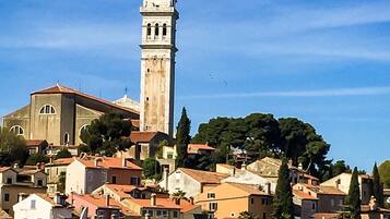 A historic town with a prominent tower and a church.
