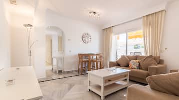 Apartment, 3 Bedrooms, 2 Bathrooms | Living room | Flat-screen TV