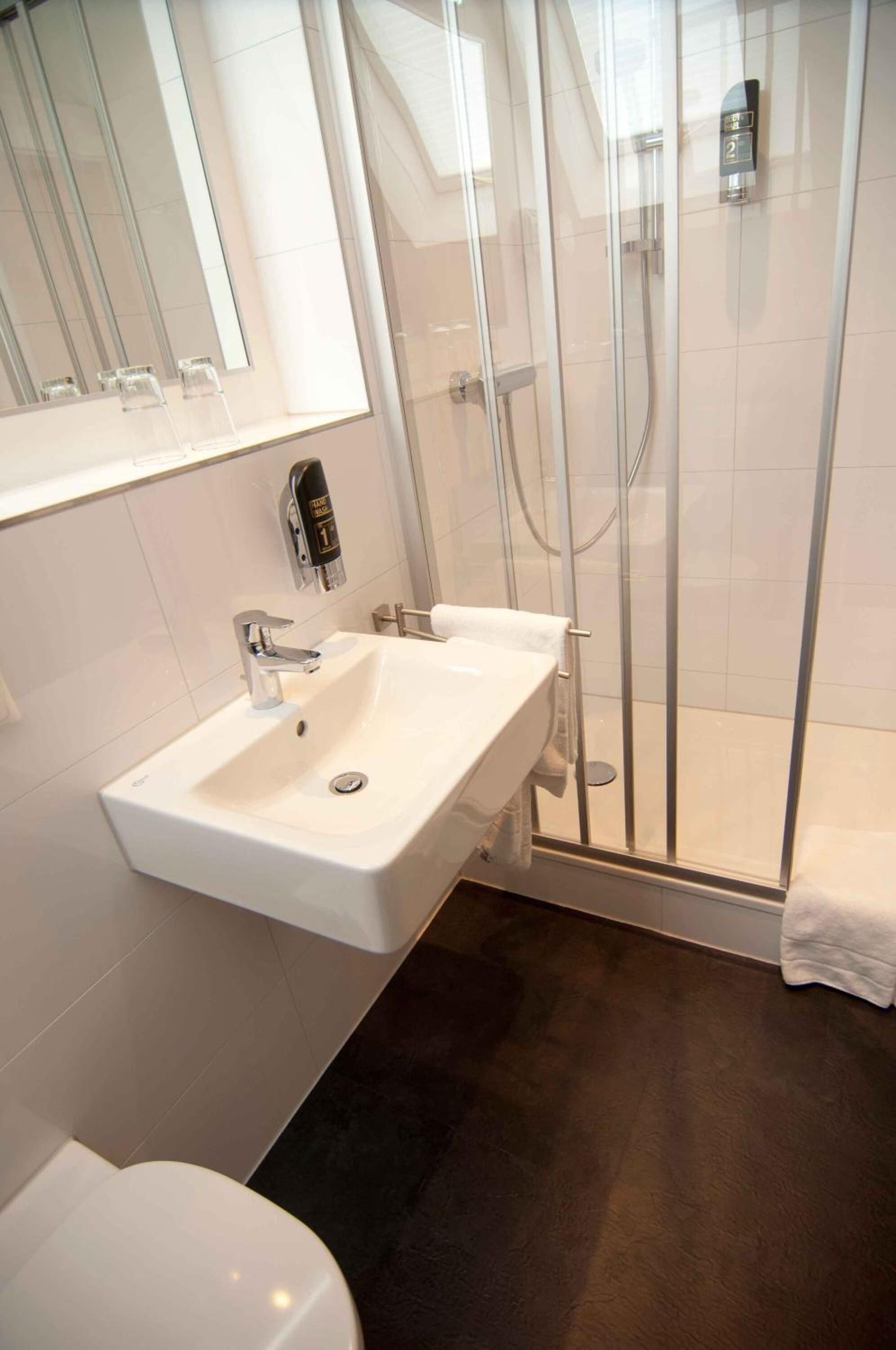 shower, free toiletries, hair dryer, towels