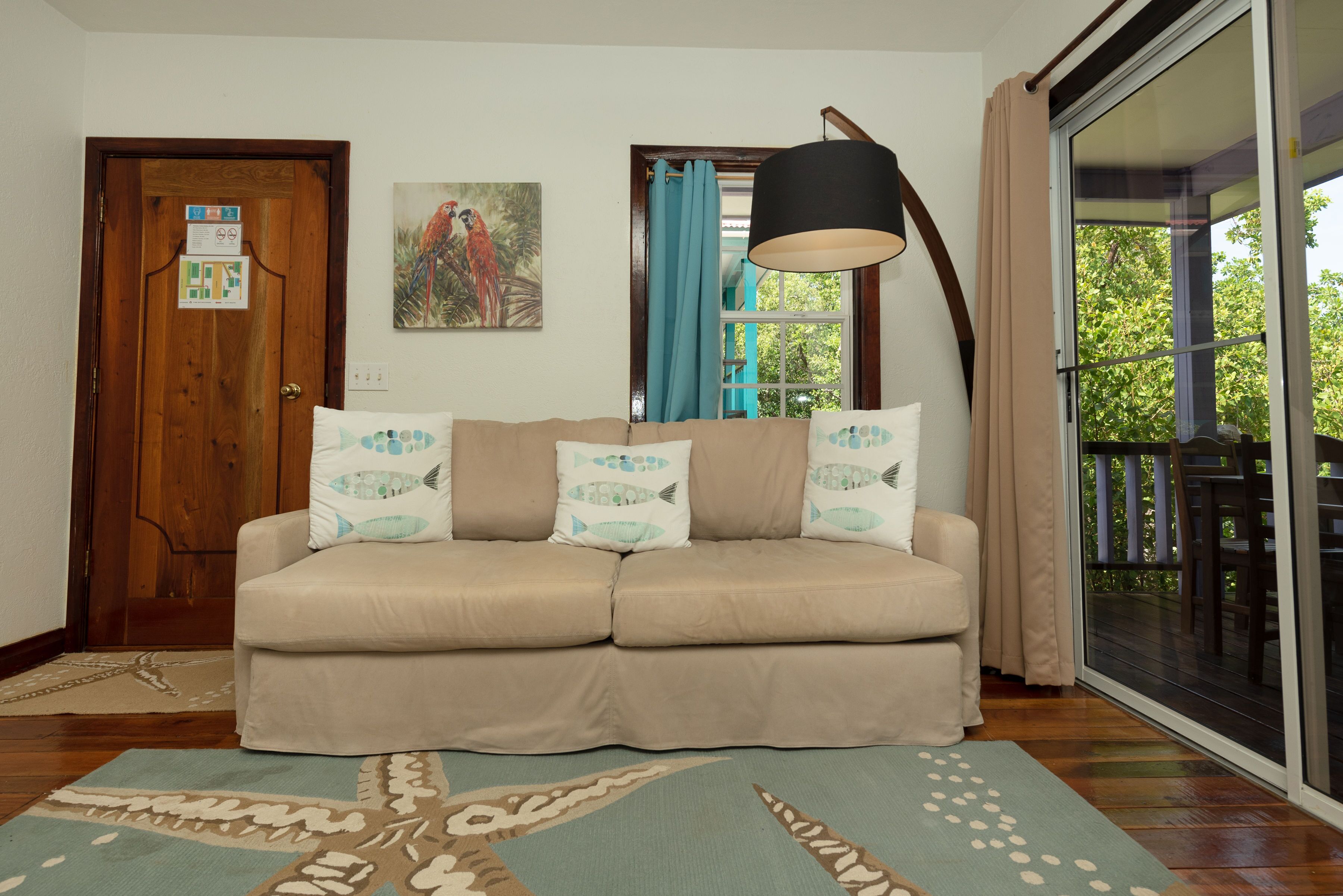 tarpon house: 1 bedroom, resort view, garden area | living area | 32-inch smart tv with cable channels, tv, netflix