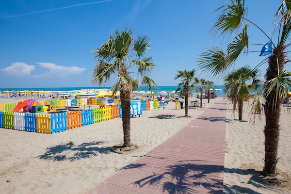 Private beach, white sand, sun loungers, beach umbrellas