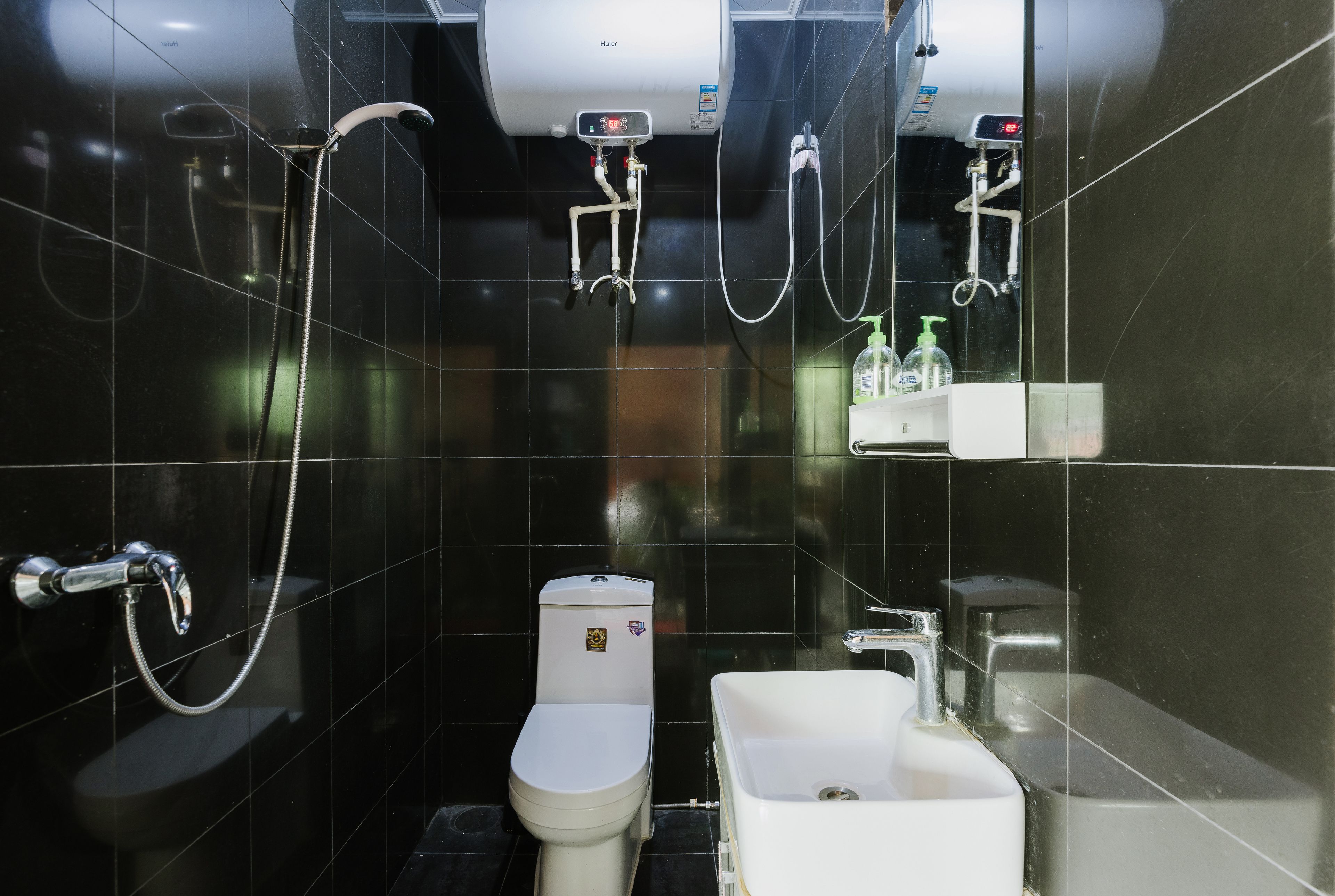 A modern bathroom with a toilet, bidet, and bathtub.