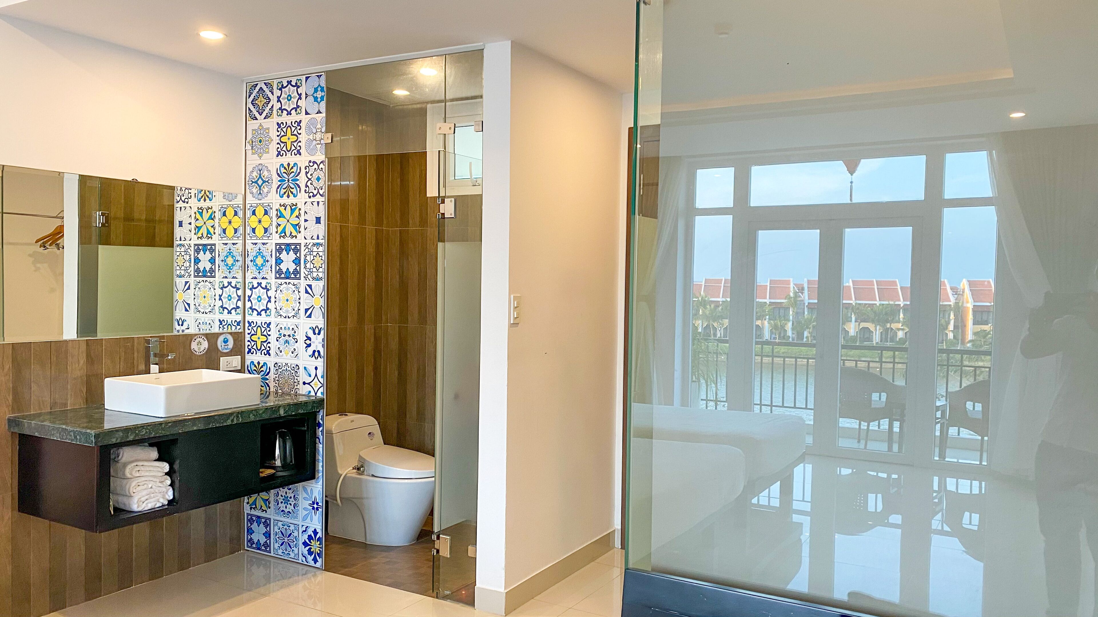 family triple room, balcony, river view | bathroom | shower, rainfall showerhead, designer toiletries, hair dryer