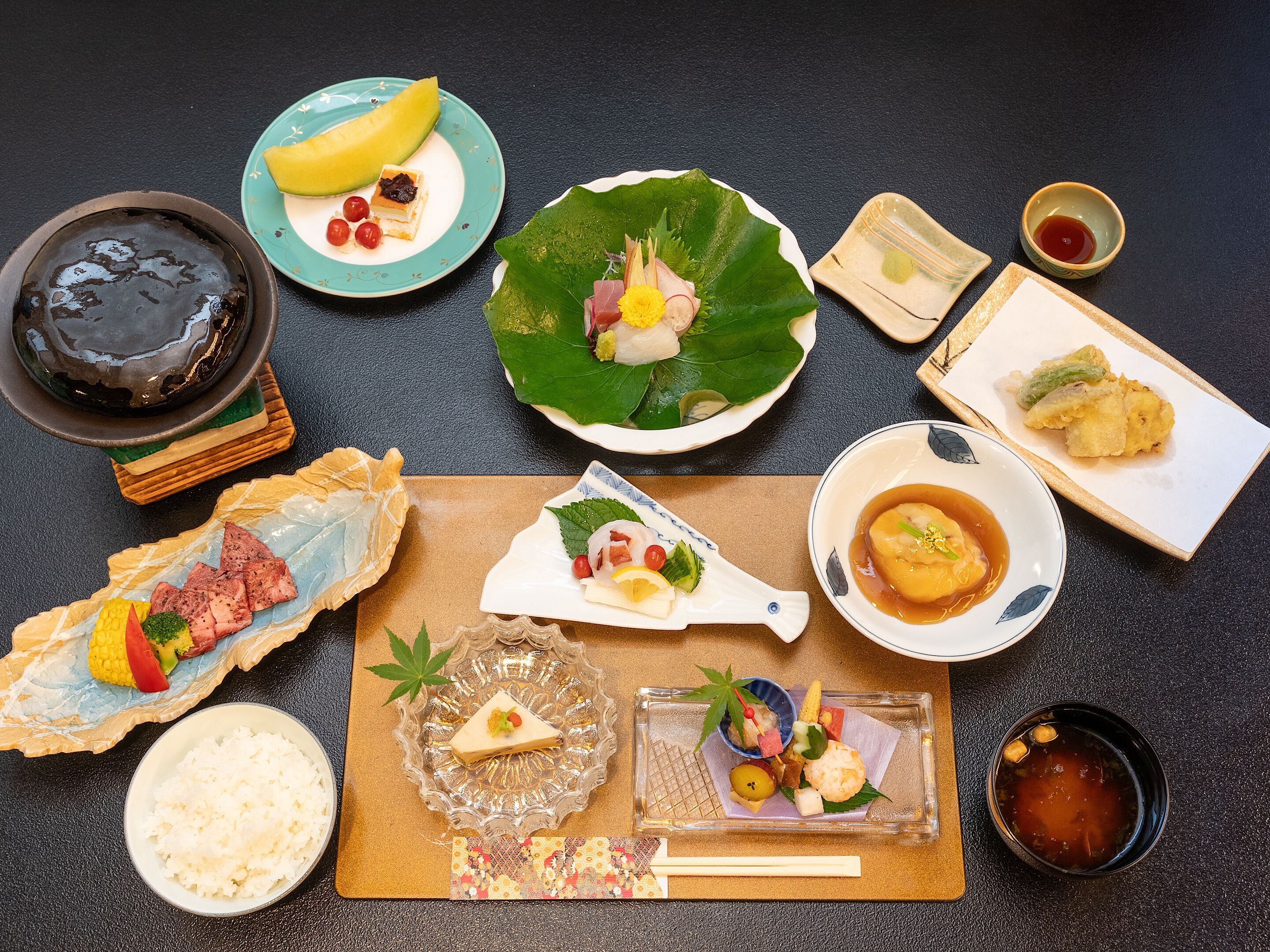 A variety of Japanese dishes arranged on a table.