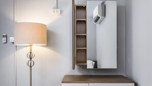 A modern bathroom with a standing lamp, a mirror, and a wooden vanity. - 1989 Sukhumvit Bangkok - Hostel (Bangkok)