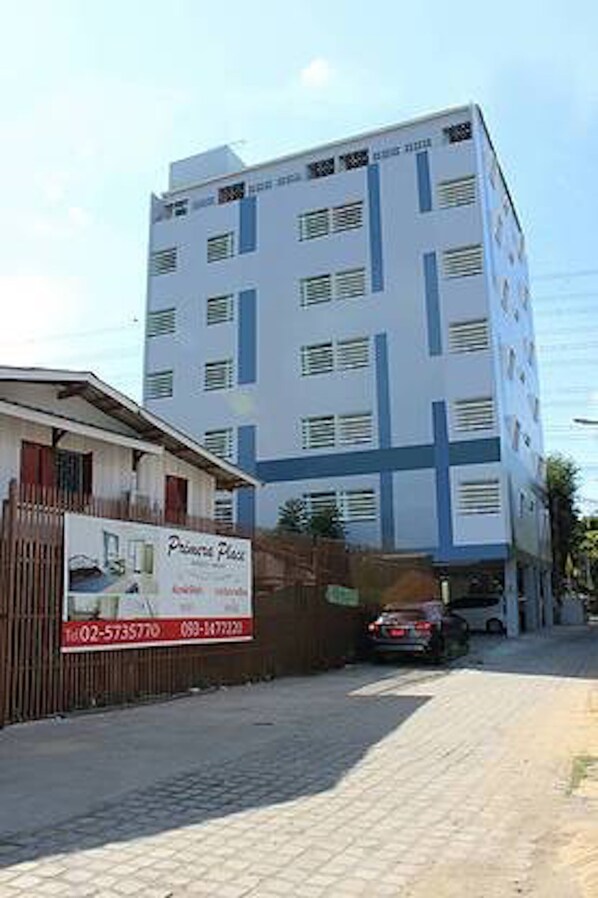 A multi-story building with a sign advertising a property named "Princess Place." - Primera Place (Pak Kret)