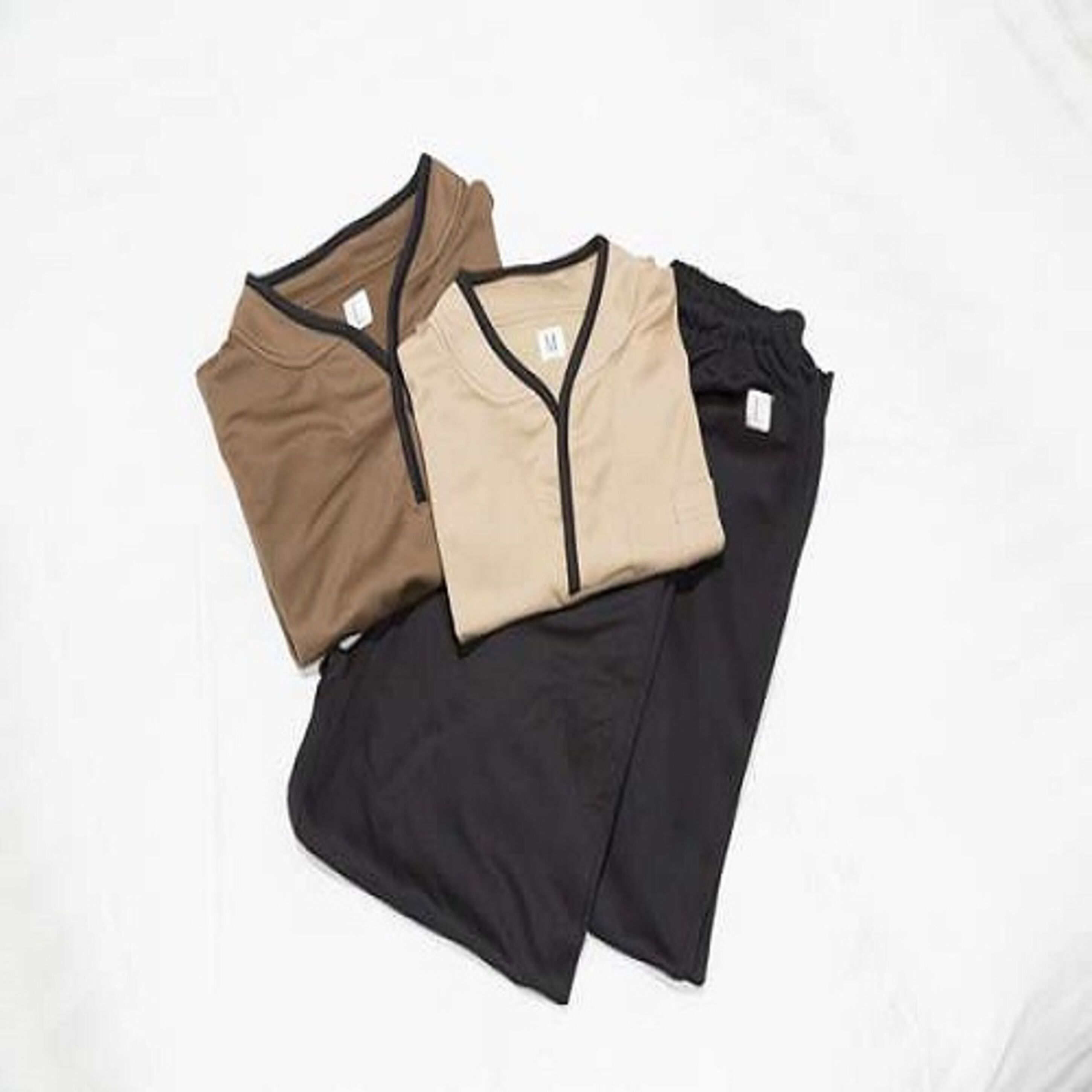 Three shirts laid out on a white background.