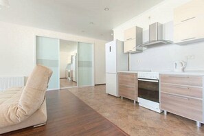 Comfort Apartment, Kitchen | Living area | Flat-screen TV, heated floors
