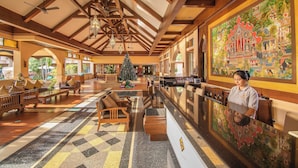 A spacious lobby with wooden beams, a reception desk, and a large mural. - Avalon Beach Resort Pattaya (Pattaya)