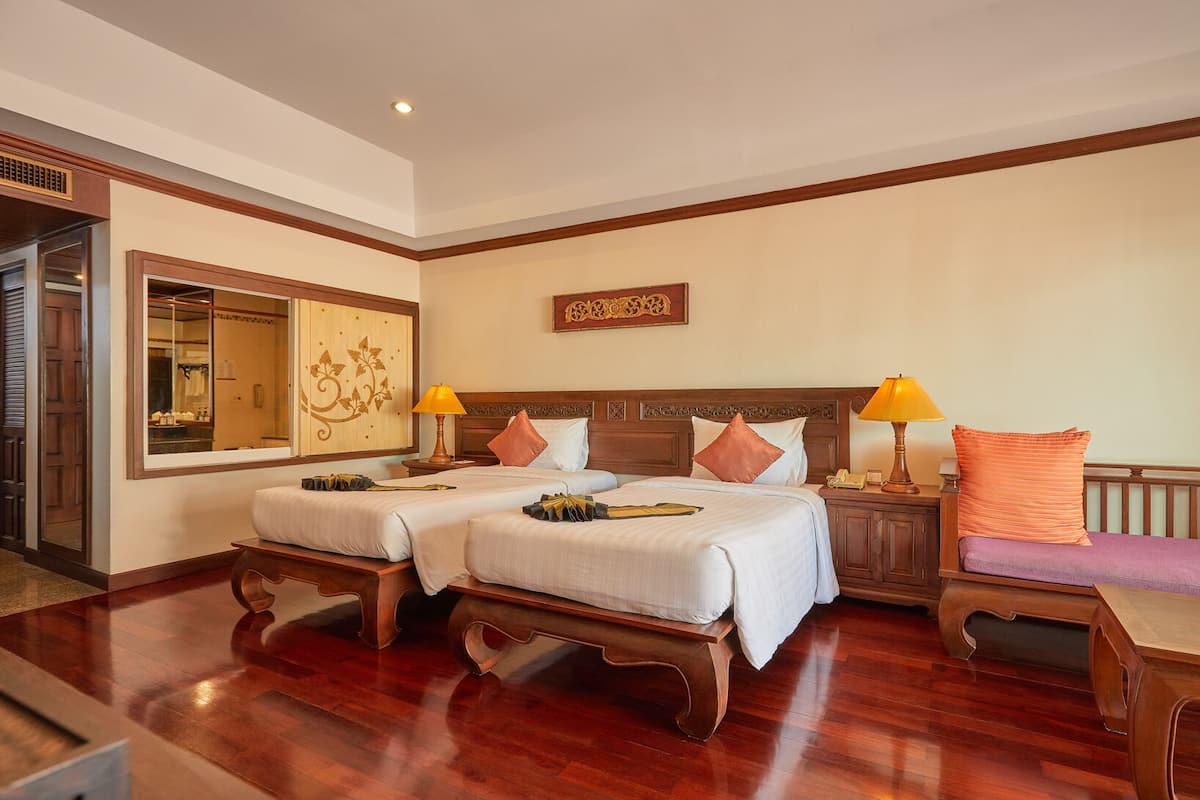 Deluxe Twin Room, Pool View | Free minibar items, in-room safe, desk, blackout curtains