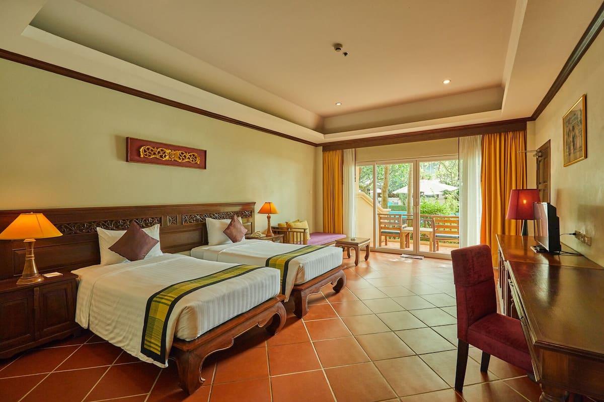 Twin Room, Pool Access | Free minibar items, in-room safe, desk, blackout curtains