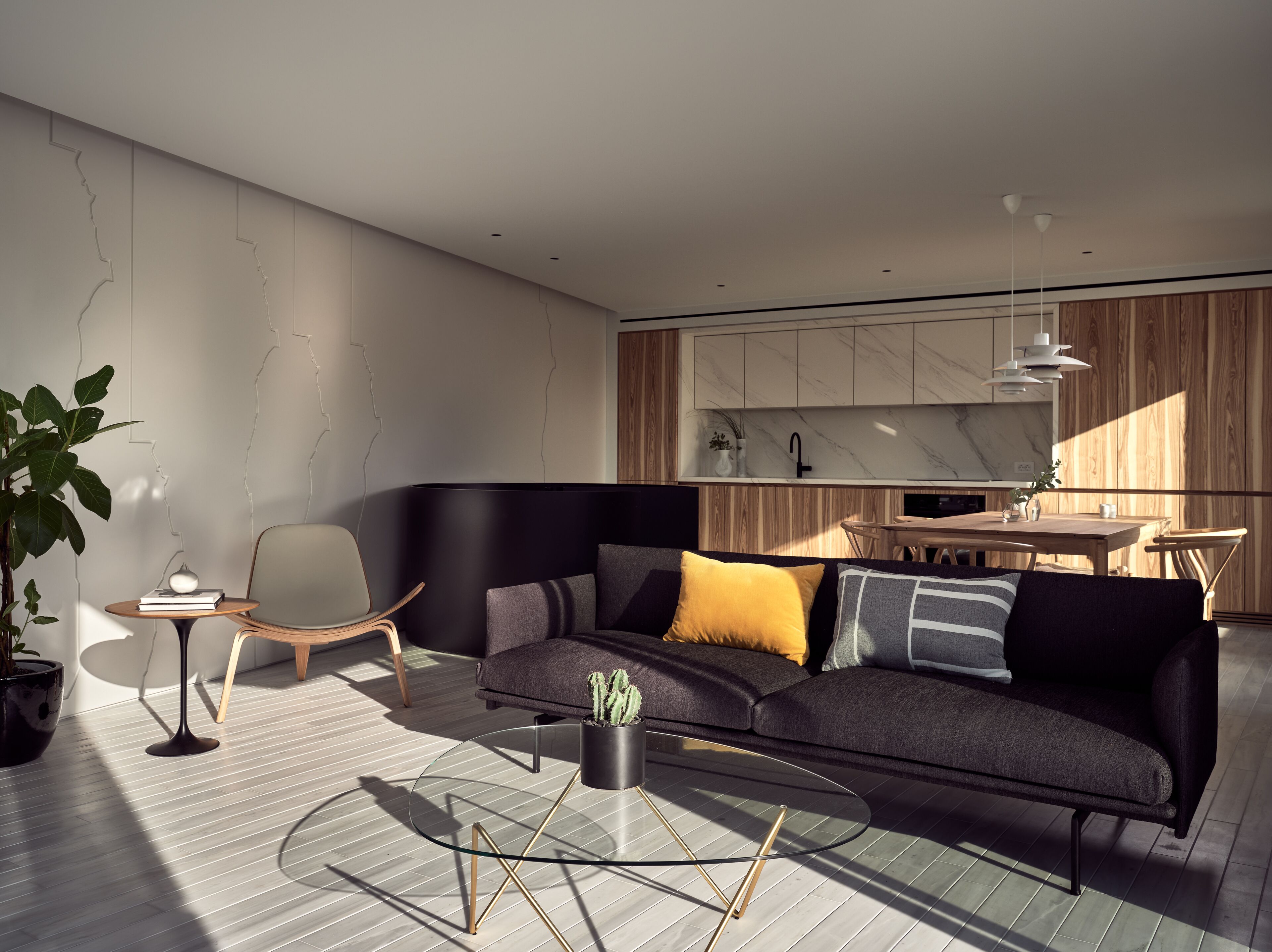 A modern living room with a sectional sofa, a glass coffee table, and a minimalist design.