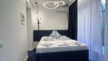 Deluxe Triple Room | Premium bedding, down duvets, in-room safe, blackout curtains