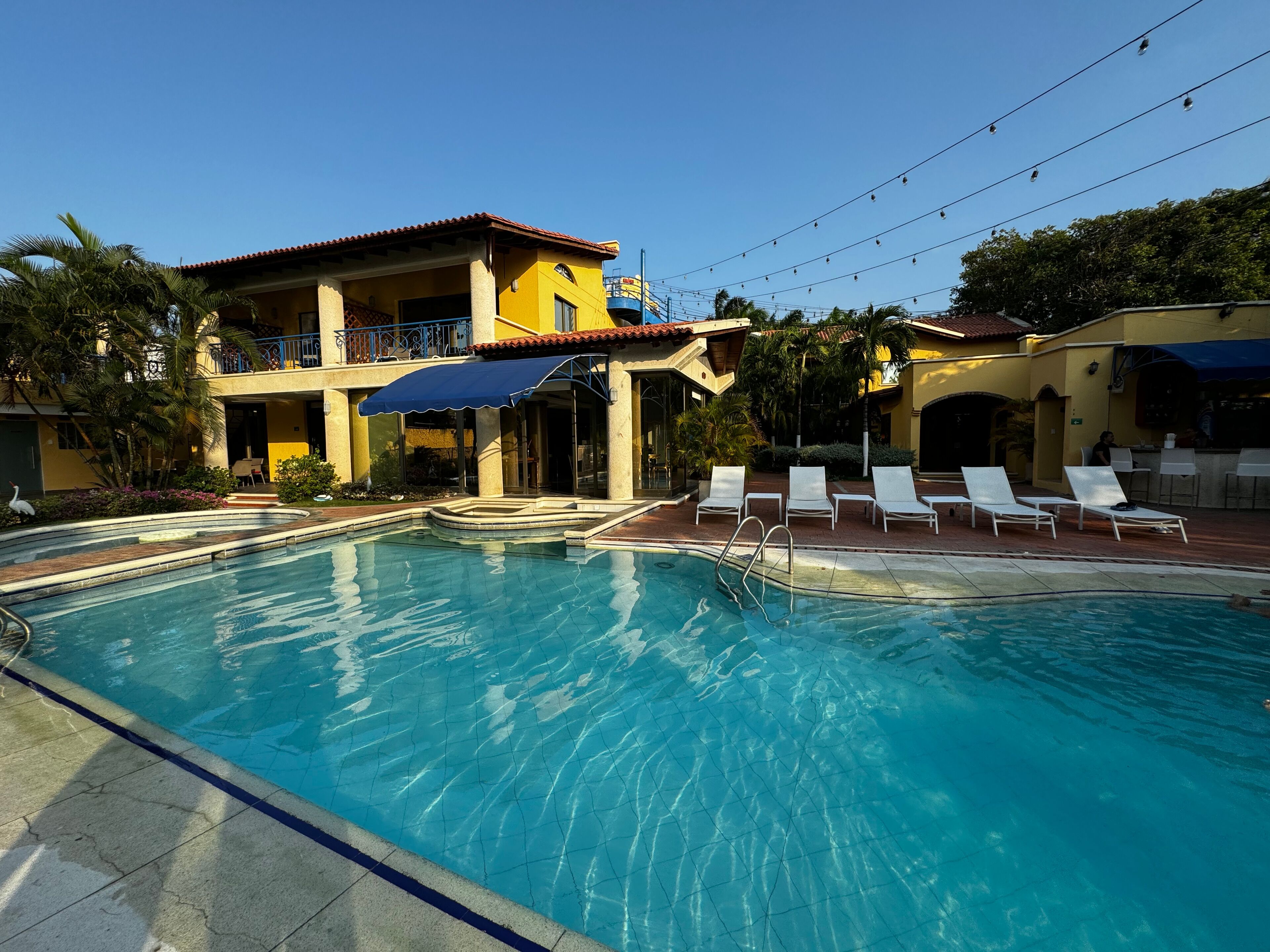 Outdoor pool, pool umbrellas, sun loungers