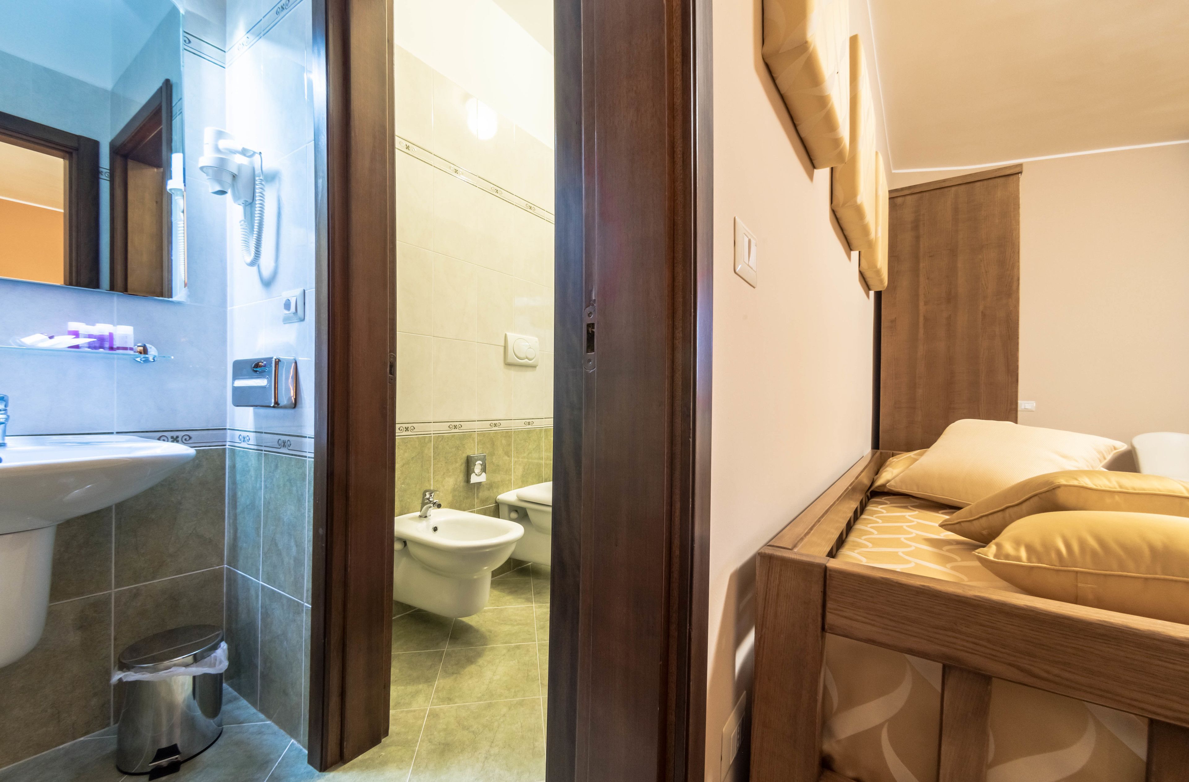 family room | bathroom | free toiletries, hair dryer, slippers, bidet