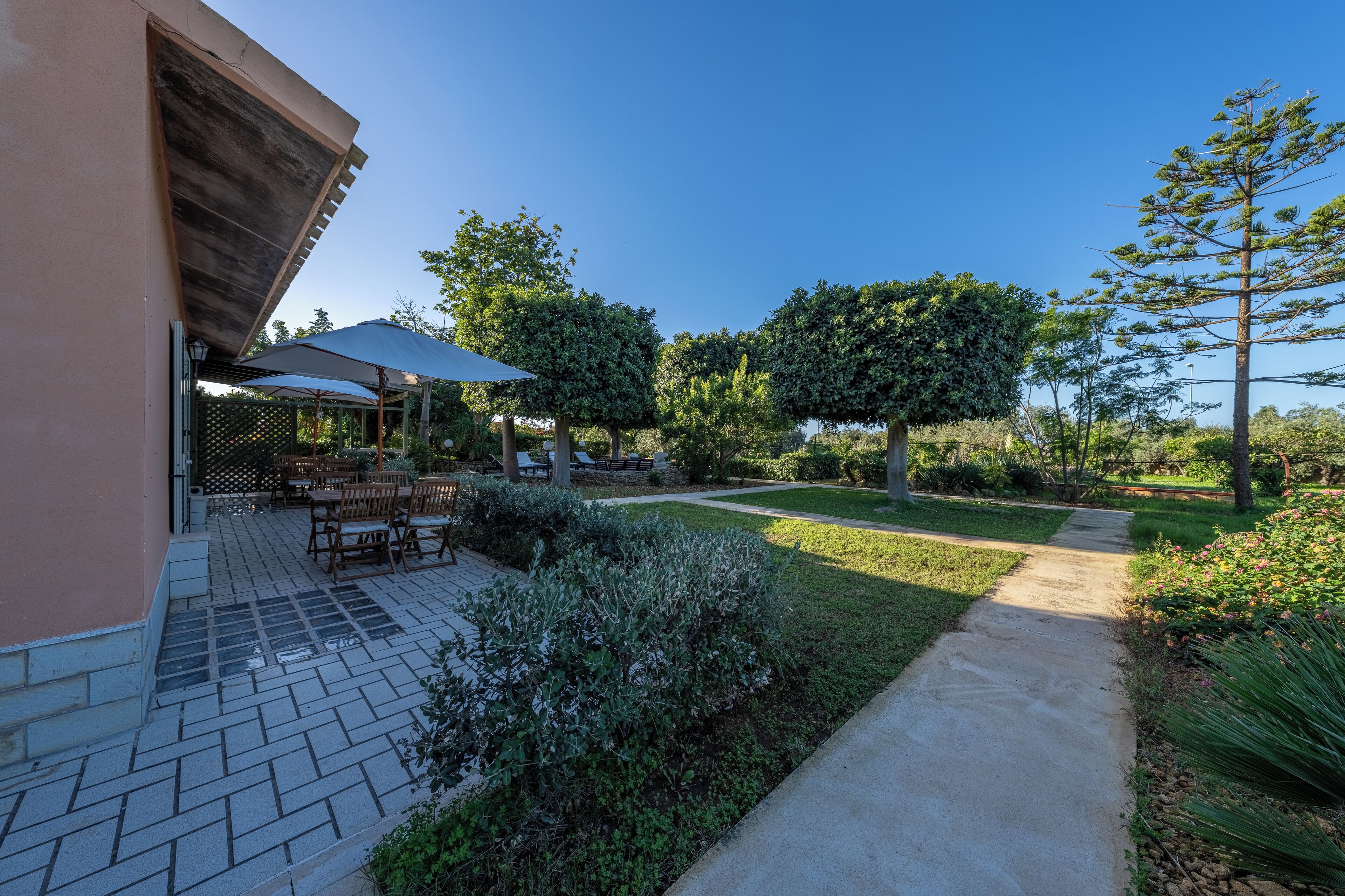 A patio area with outdoor furniture and a covered seating area.
