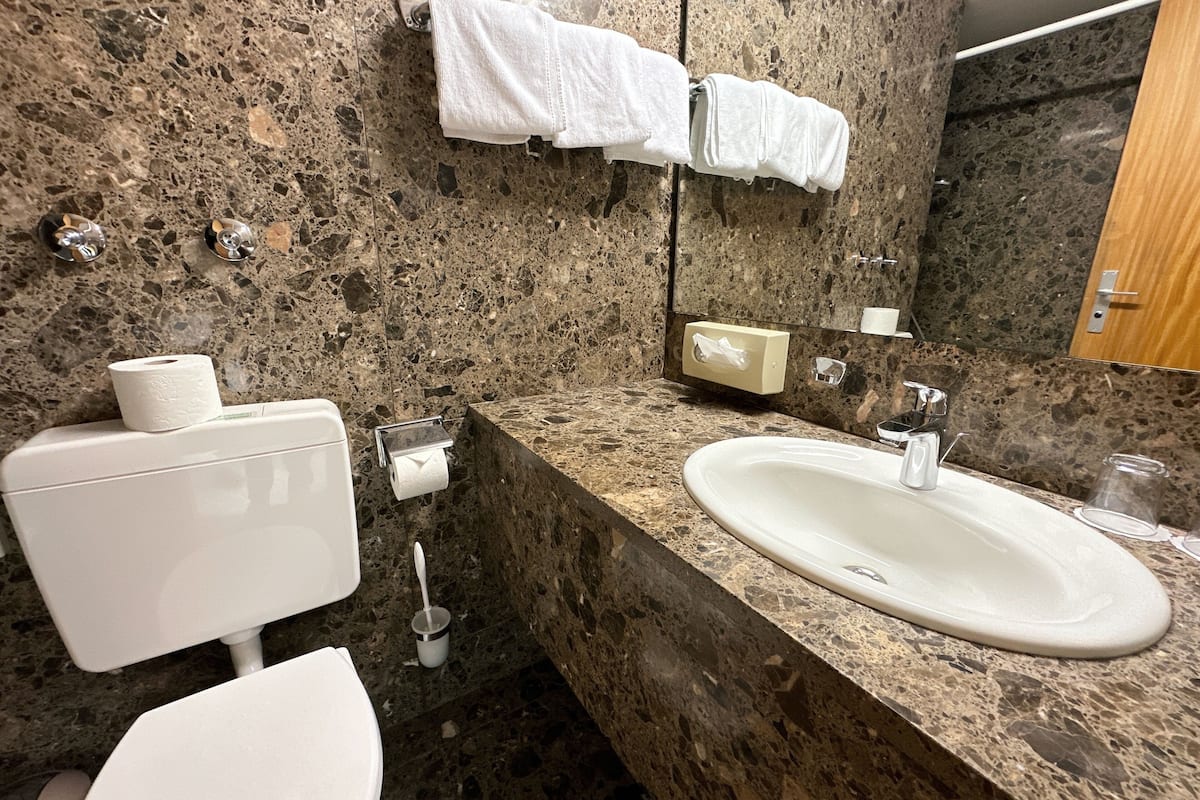 classic double room, 1 queen bed | bathroom | hair dryer, towels