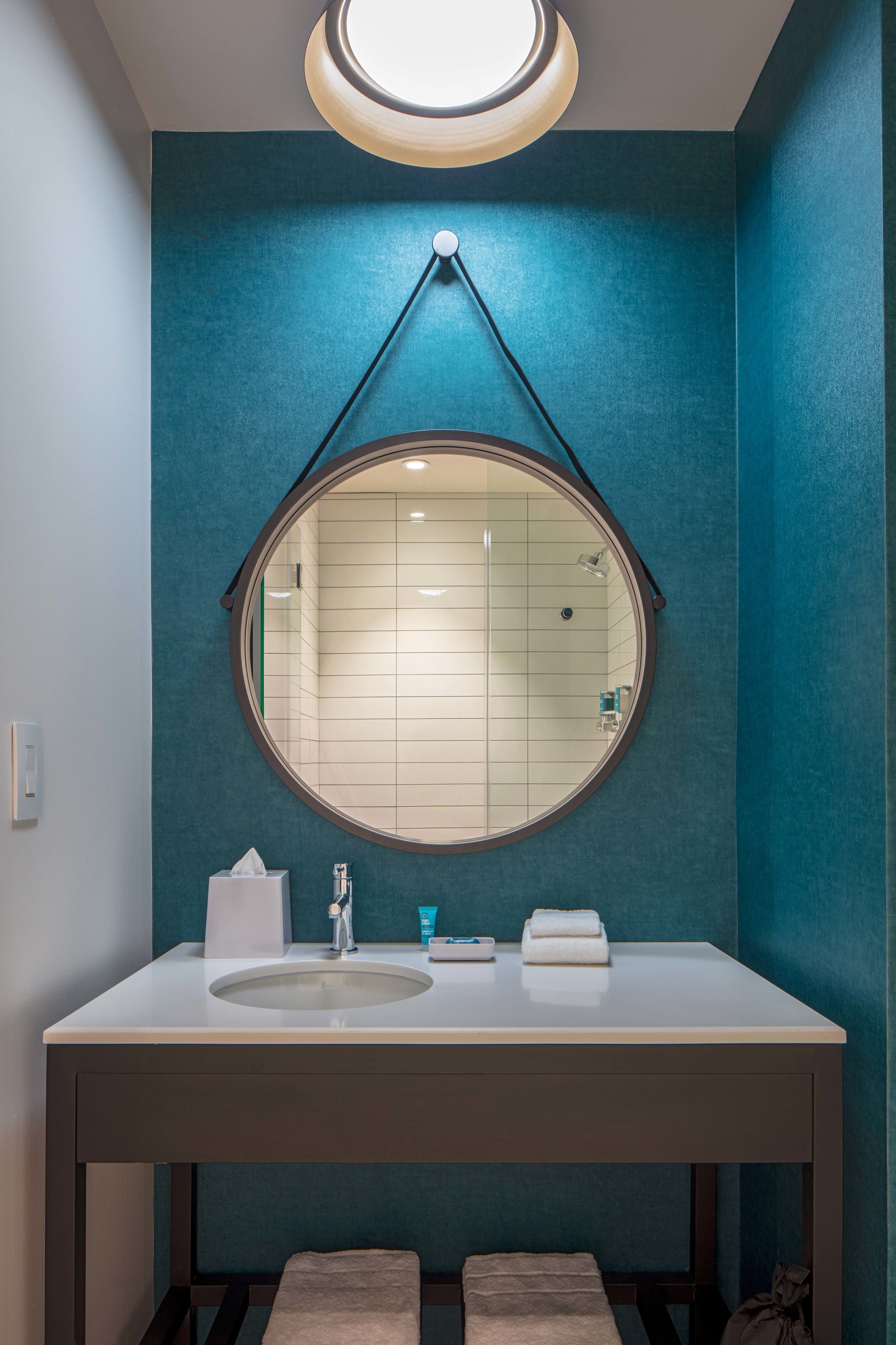 shower, designer toiletries, hair dryer, towels