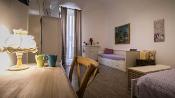 Comfort Quadruple Room | Living area | Flat-screen TV