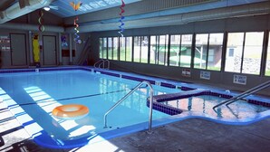 An indoor swimming pool with clear signage indicating no diving and no swimming allowed. - Betsie Riverside Resort (Benzonia)