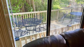 Cabin 10 (Twin Beds After Labor Day) | Living area | 35-inch flat-screen TV with cable channels, TV, DVD player