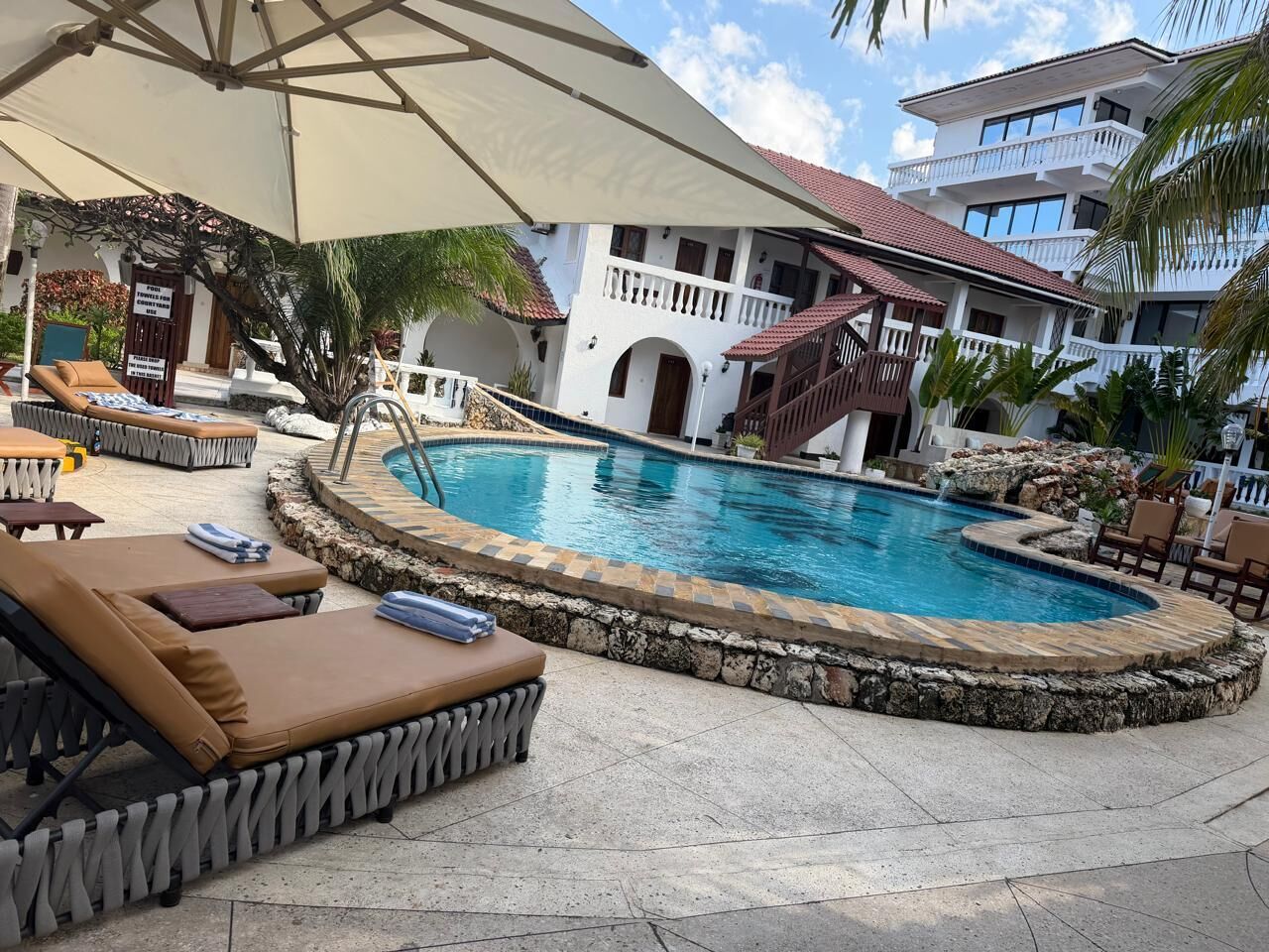2 outdoor pools, open 8 AM to 10 PM, pool umbrellas, pool loungers