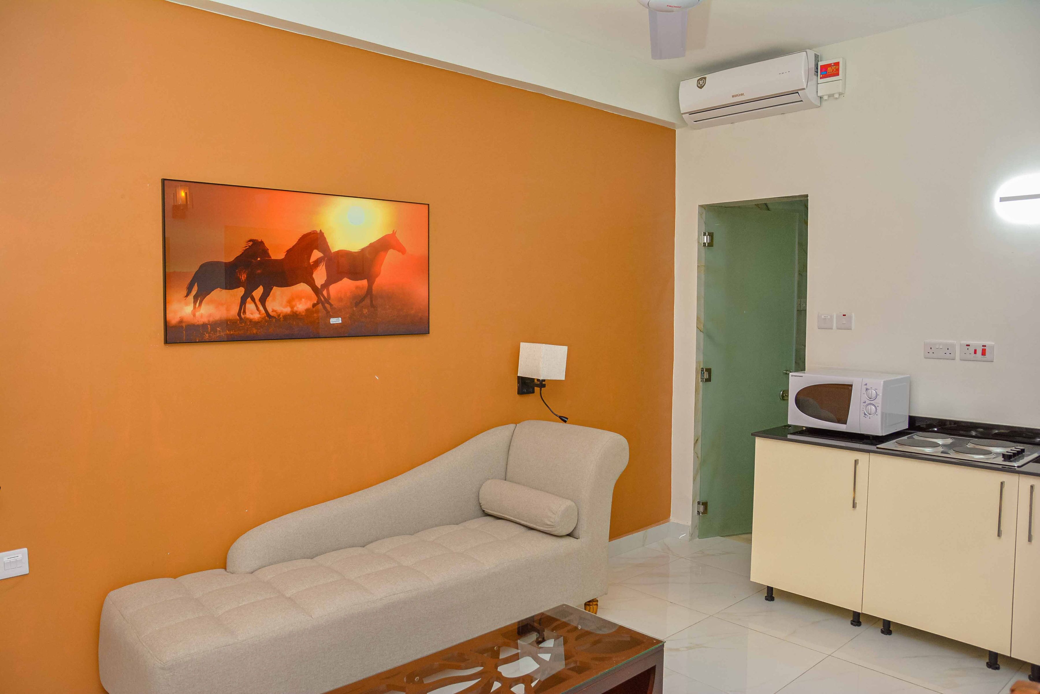 suite room with living room including kitchen, jacuzzi in the room | living area | 53-inch smart tv with digital channels, tv, netflix