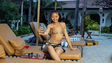 2 outdoor pools, open 8 AM to 10 PM, pool umbrellas, pool loungers