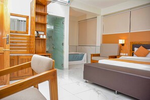 Suite room with living room including kitchen, Jacuzzi in the room | Premium bedding, minibar, in-room safe, individually decorated - Best Western Jangwani Sea Breeze Hotel (Dar es Salaam)