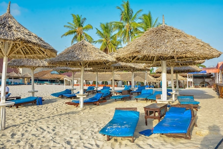 Private beach, white sand, sun loungers, beach umbrellas
