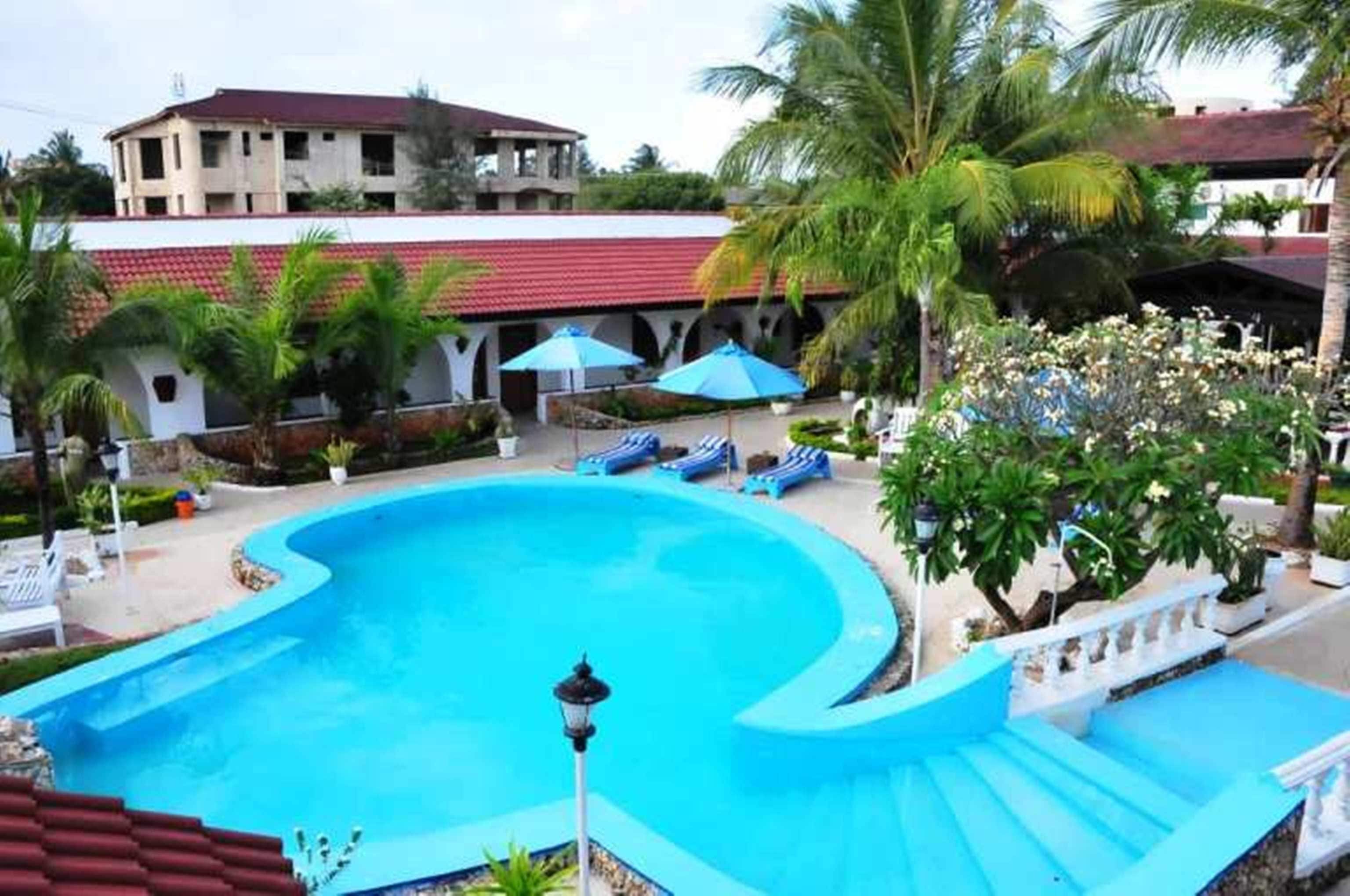 2 outdoor pools, open 8 AM to 10 PM, pool umbrellas, sun loungers