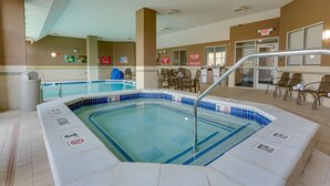A hotel pool area with a hot tub, lounge chairs, and a 'No Diving Allowed' sign. - Drury Plaza Hotel St. Louis St. Charles (St. Charles)