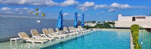 Outdoor pool, open 8:00 AM to 8:00 PM, pool umbrellas, pool loungers - Anah Suites - Las Flores Properties (Playa del Carmen)