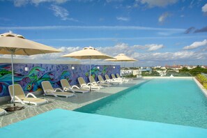 Outdoor pool, open 8:00 AM to 8:00 PM, pool umbrellas, sun loungers