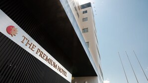A hotel sign with the name "THE PREMIUM HOTEL" and a logo. - The Premium Hotel in Rinku (Izumisano)