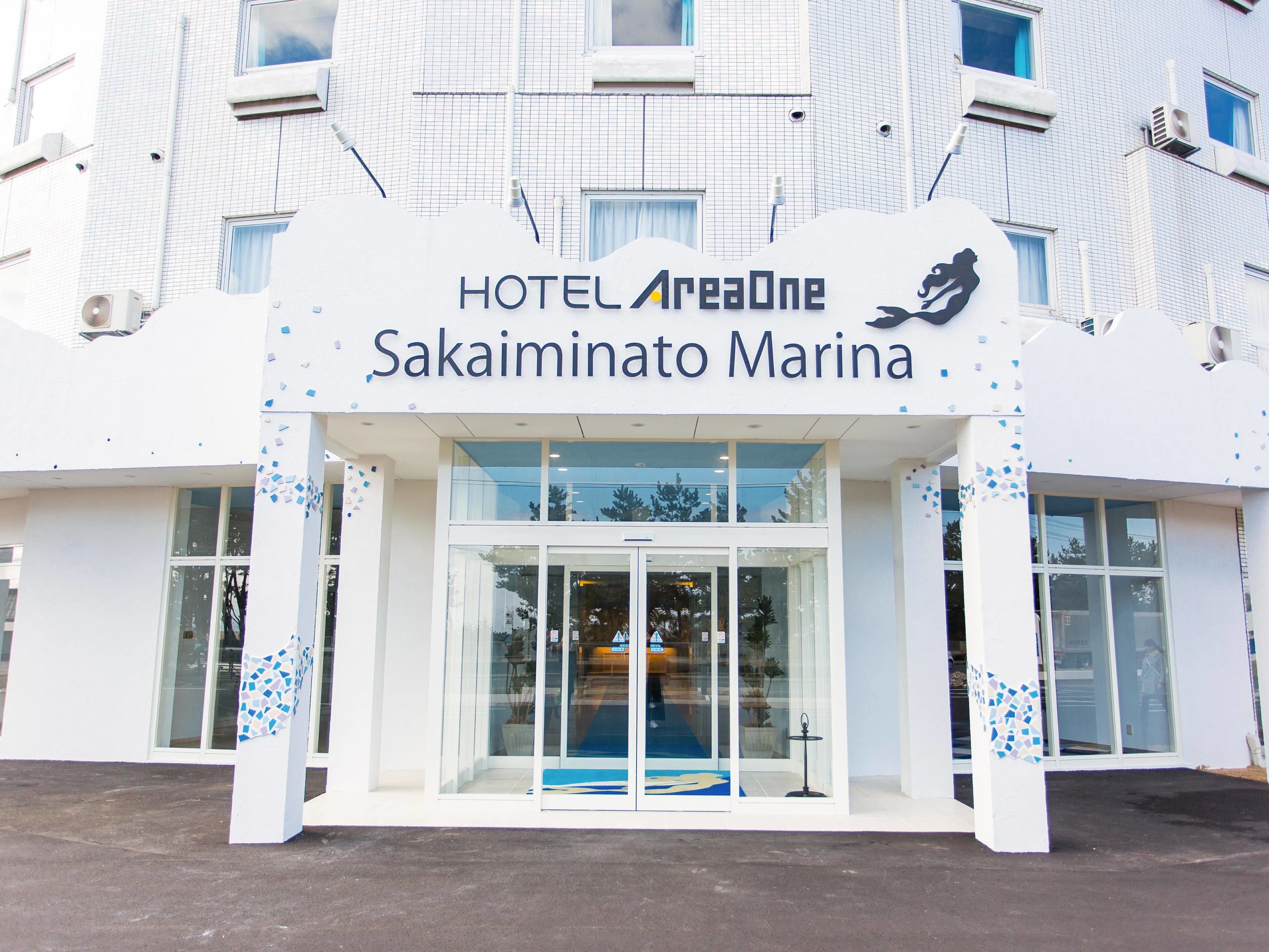 A hotel entrance with a sign reading "HOTEL AreaOne Sakaiminato Marina".