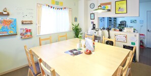 Enjoy casual meals and gatherings in this inviting dining area with a large window and comfortable seating.