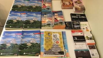 A collection of travel guides and promotional materials for Himeji City, including various book covers and brochures.