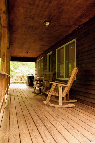 Classic mountain cabin with beautiful stone fireplace in a rural setting