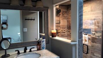 Shower, hair dryer, towels, shampoo