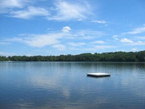 A calm lake with a dock extending into the water. - Luxury Fox Hollow Estate Home on Laurel Lake - Dream Location, Hot Tub, Kayaks++ (Lenox)