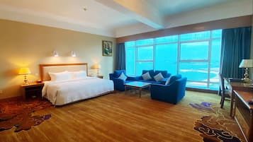 Deluxe Room, 1 King Bed | In-room safe, desk, iron/ironing board, free WiFi